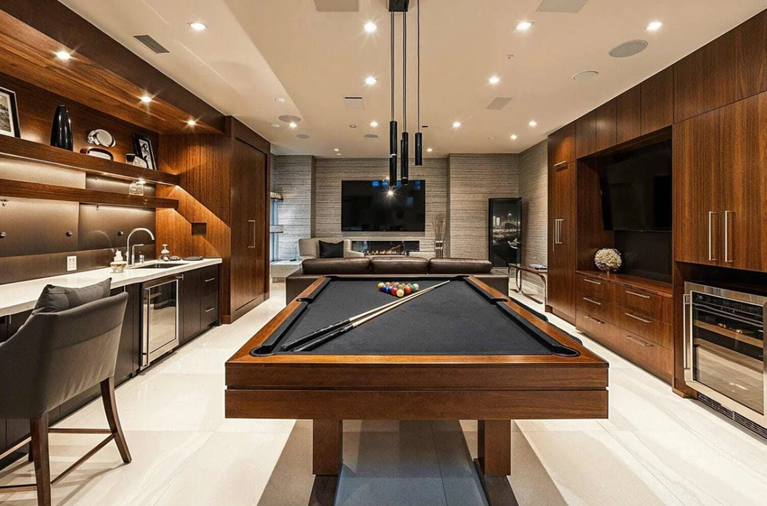 A wet bar and lounge renovated by BCR Basements. 