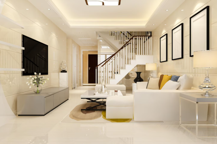 Finished basement family room with white seating and staircase